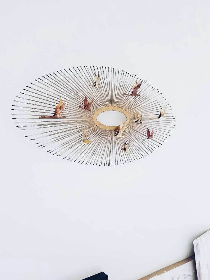 MID-CENTURY MODERN WALL SCULPTURE "BIRDS IN FLIGHT ON SUNBURST"